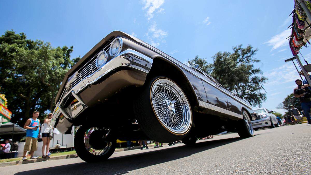 AMANDA McCOY/SUN HERALD/FILEA low rider rolls by on three wheels at Scrapin' the Coast 2015. This is the event's 14th year, and the events kick off Saturday and Sunday, but registration opens on Friday.