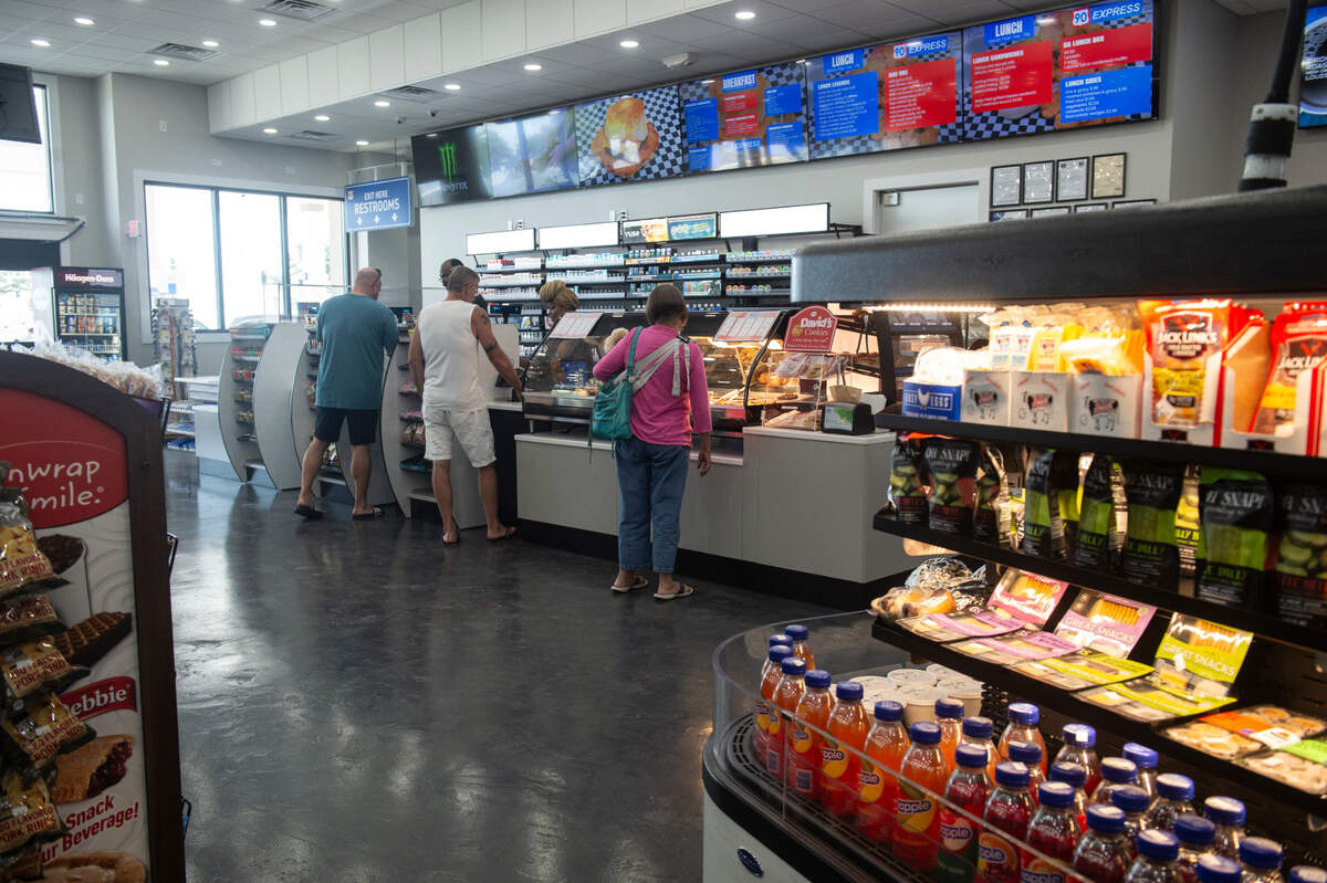 Customers check out at the new 90 Express gas station on Highway 90 in Biloxi.
