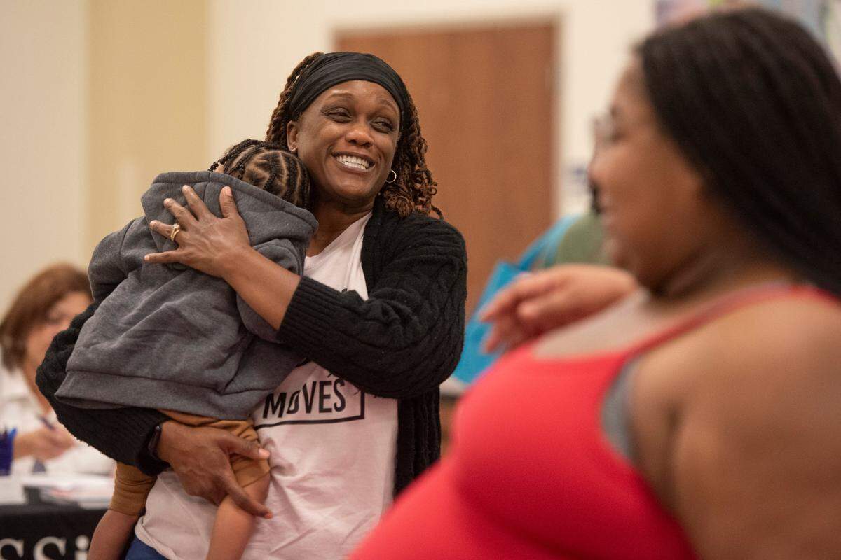 Expecting families meet with vendors during a community baby shower event at Lyman Community Center in Gulfport on Thursday, Nov. 14, 2024.