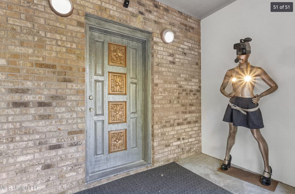 A home for sale on Graveline Road in Gautier has purple and orange walls, mirrors and mannequins throughout.