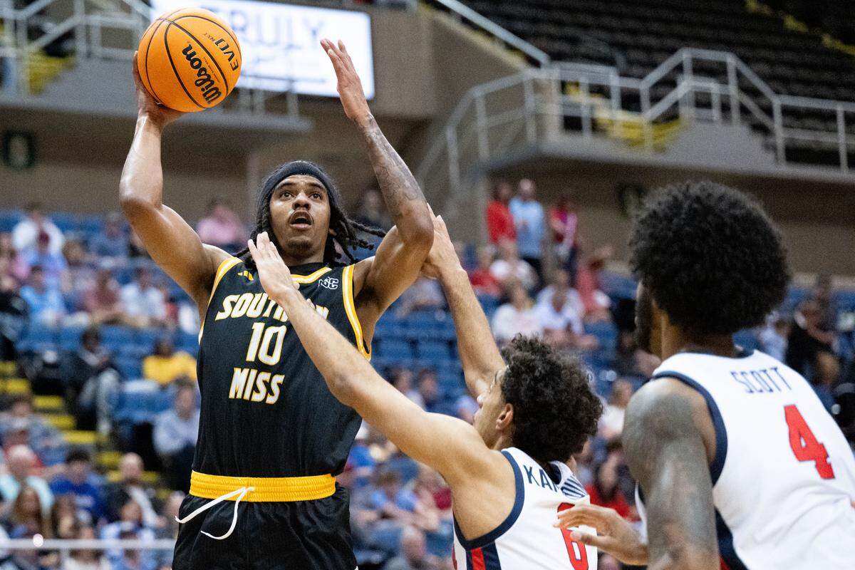 Southern Mississippi guard Isaac Taveras (10) leaps as he looks to take a shot.
