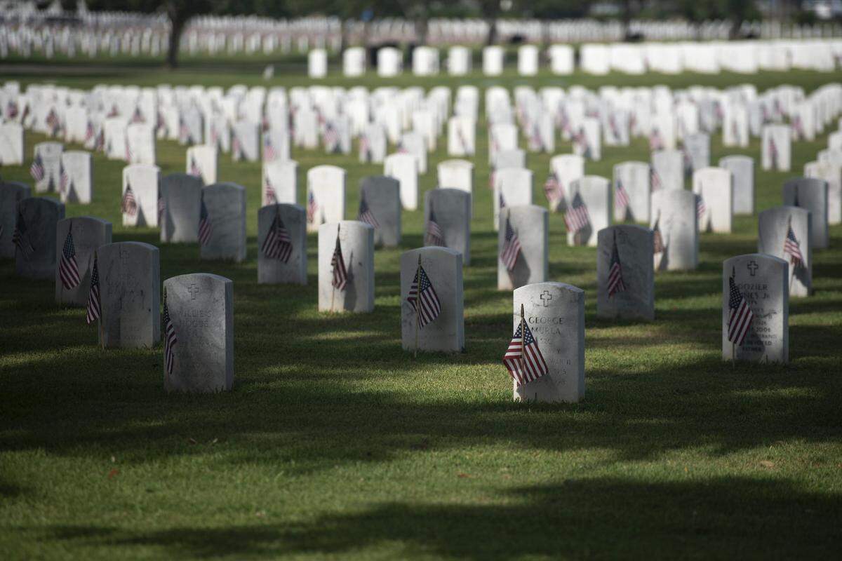 American flags decorate the headstones at Biloxi National Cemetery in Biloxi for Memorial Day on Monday, May 26, 2025.