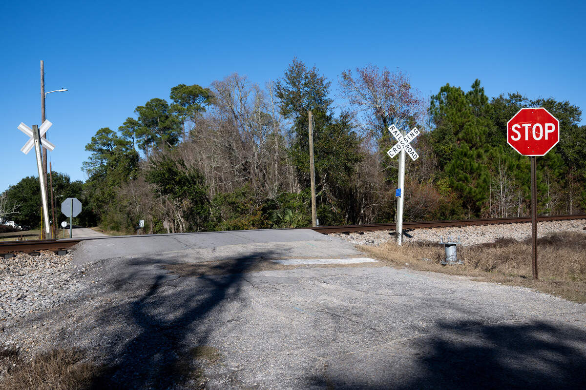 A railroad crossing and stop sign on Courtenay Avenue in Pass Christian on Friday, Dec. 19, 2025.