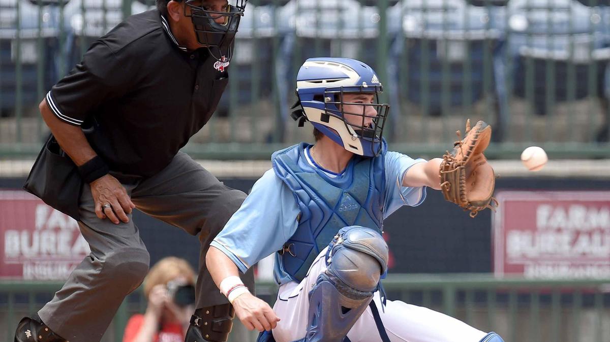 Resurrection Catholic catcher Joe Scarborough receives a pitch against Tupelo Christian at the MHSAA State Baseball Championships at Trustmark Park in Pearl, Miss., on Tuesday, June 1, 2021.