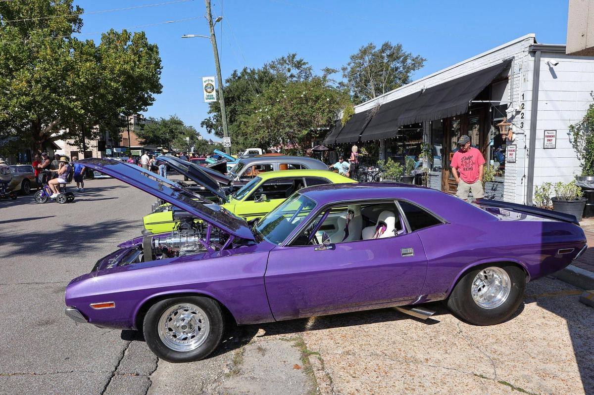 Vintage muscle cars line the streets during the Ocean Springs Cruisin’ the Coast Block Party, October 8, 2021.