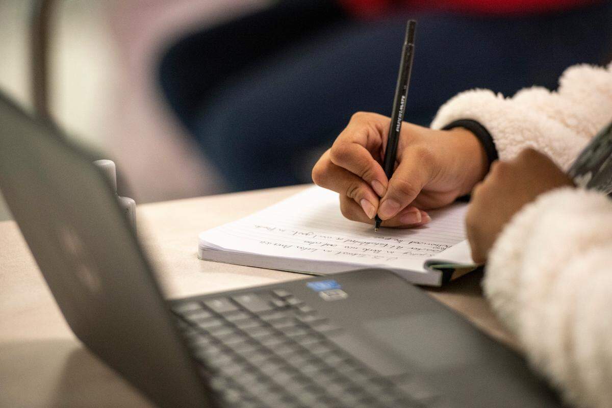 A student takes notes during Hayden Roberts’ history class at Pascagoula High School on Monday, Oct. 25, 2021. Many of the students in the class are learning English as their second language while attending classes that are taught in English.