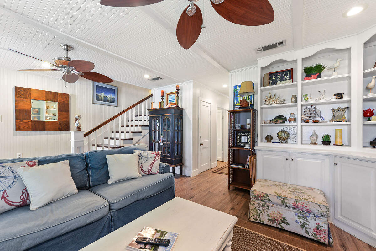 The living room at Breezy Porches in Waveland, where owners Glenn Hood and Charles “Chuck” Underwood have filled the unique home with art and creative design elements.