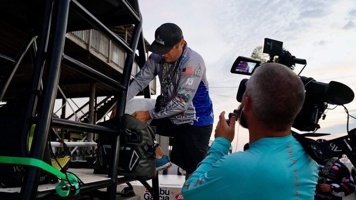 A member of the Elite Fishing League is shown being filmed during the Tidewater Tour Championship in Delacroix, Louisiana, in August 2020.