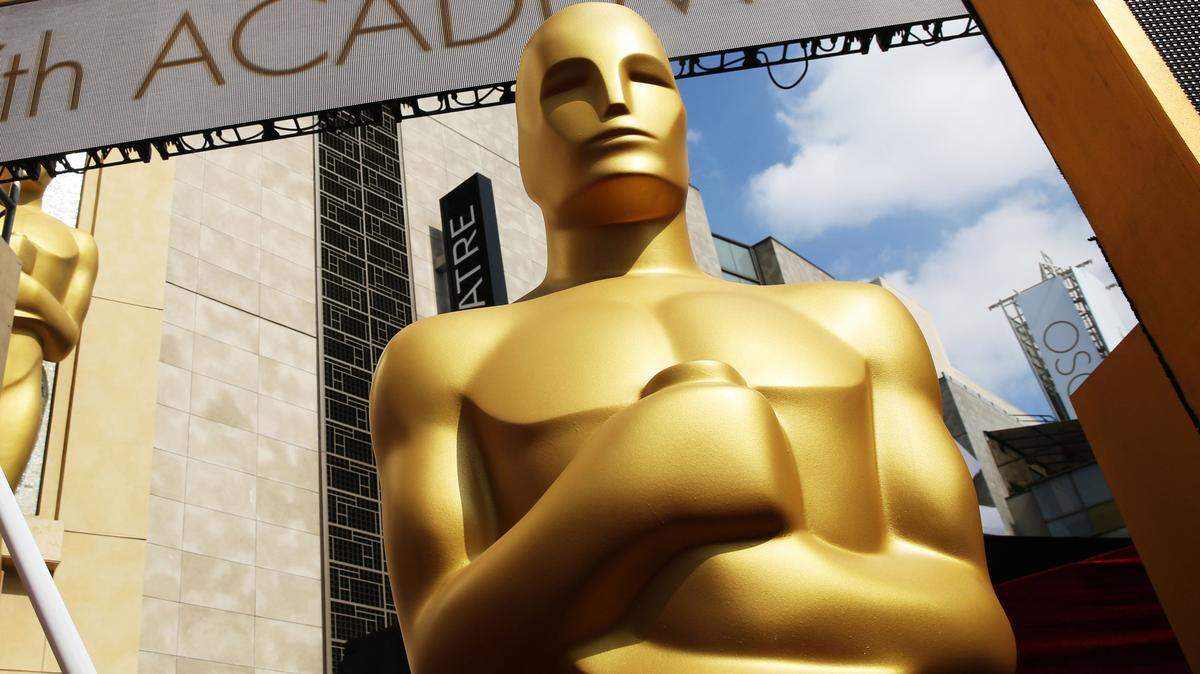 MATT SAYLES/INVISION/ASSOCIATED PRESS/2015An Oscar statue appears outside the Dolby Theatre in Los Angeles for the 87th annual Academy Awards in 2015. This year's Oscars begin at 7:30 p.m. Sunday.