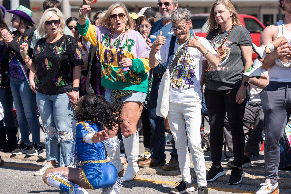 The crowd reacts to dancers during the Jackson County Carnival Association Mardi Gras parade in Pascagoula on Saturday, March 1, 2025.
