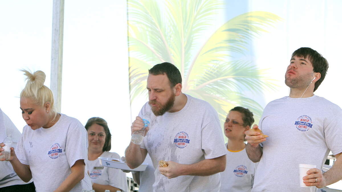 TIM ISBELL/SUN HERALDJoey Chestnut, center, won the Meat Pie Eating contest Saturday at Silver Slipper Casino. Mike Sud, left, came and second and Adrian Morgan, right, was third.