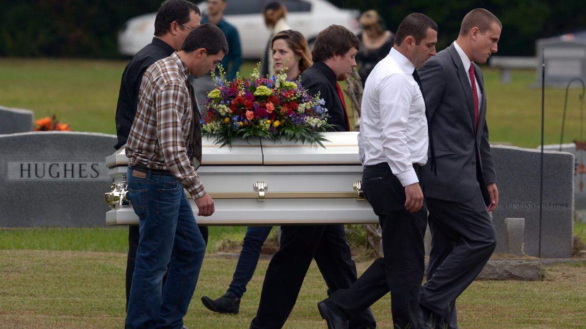 Pallbearers carry the casket of 6-year-old Jeremy Mardis to the grave site at Beaumont Cemetery in Beaumont, Miss., 30 miles east of Hattiesburg, Monday, Nov. 9, 2015. Jeremy Mardis, a 6-year-old autistic boy, was killed and his father wounded when marshals opened fire on their vehicle in Marksville, La. on Nov. 3. Louisiana State Police announced late Friday that they had arrested the two marshals in the shooting. (Eli Baylis\Hattiesburg American via AP)