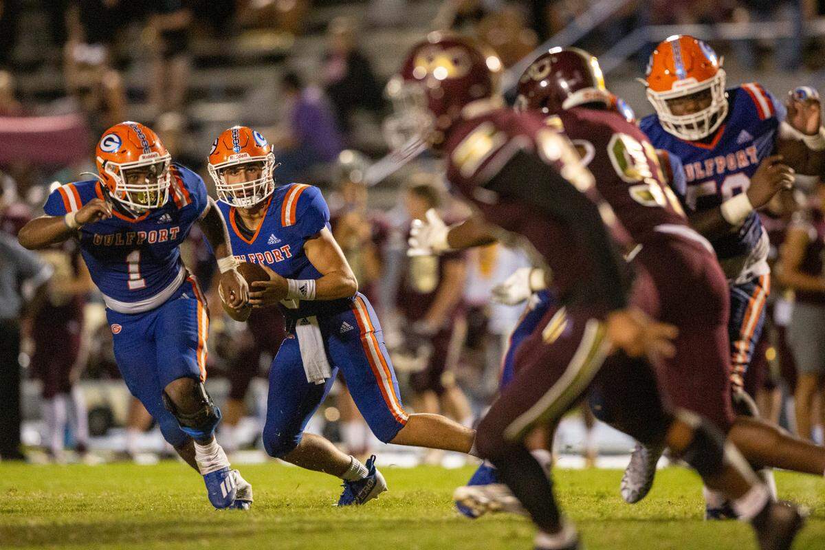 Gulfport quarterback Jacob Palazzo looks for a pass during a game against George County at Milner Stadium in Gulfport on Saturday, Aug. 27, 2022.
