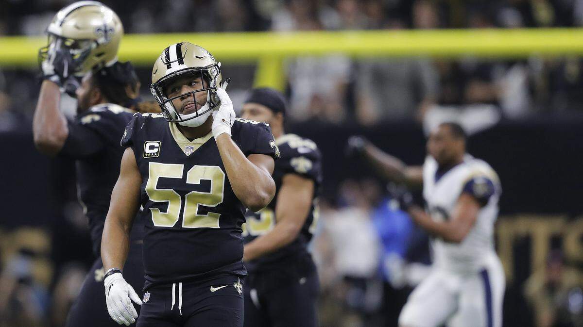 New Orleans Saints linebacker Craig Robertson (52) leaves the field after overtime of the NFL football NFC championship game against the Los Angeles Rams Sunday in New Orleans.
