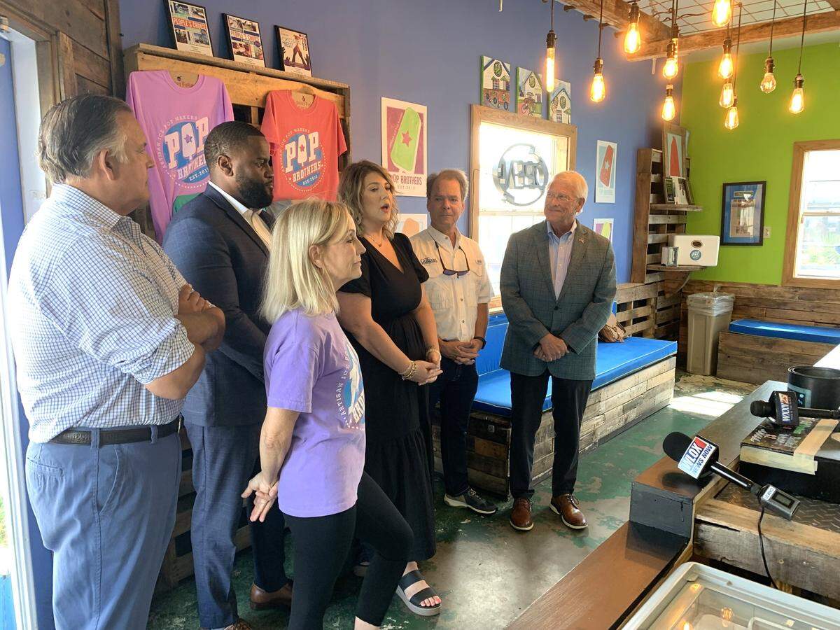 Gulfport Mayor Billy Hewes and U.S. Sen. Roger Wicker, right, stand with business leaders and owners in Gulfport, envisioning the economic boost Amtrak passenger trains could bring to South Mississippi starting early next year. Pictures from left are Octavio and Shannon Arzola, owners of Pop Brothers, Bryan Jacobs, insurance agent and small business owner, Kristen Garriga, director of Gulfport Main Street, Hewes and Wicker.