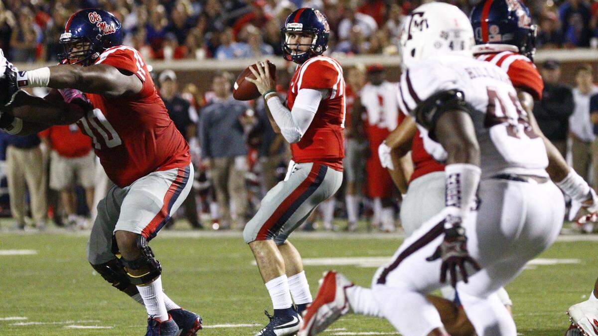 Mississippi quarterback Chad Kelly (10) sets up to pass against Texas A&M during the second half of their NCAA college football game against Mississippi in Oxford, Miss., Saturday, Oct. 24, 2015. No. 24 Mississippi won 23-3. (AP Photo/Rogelio V. Solis)