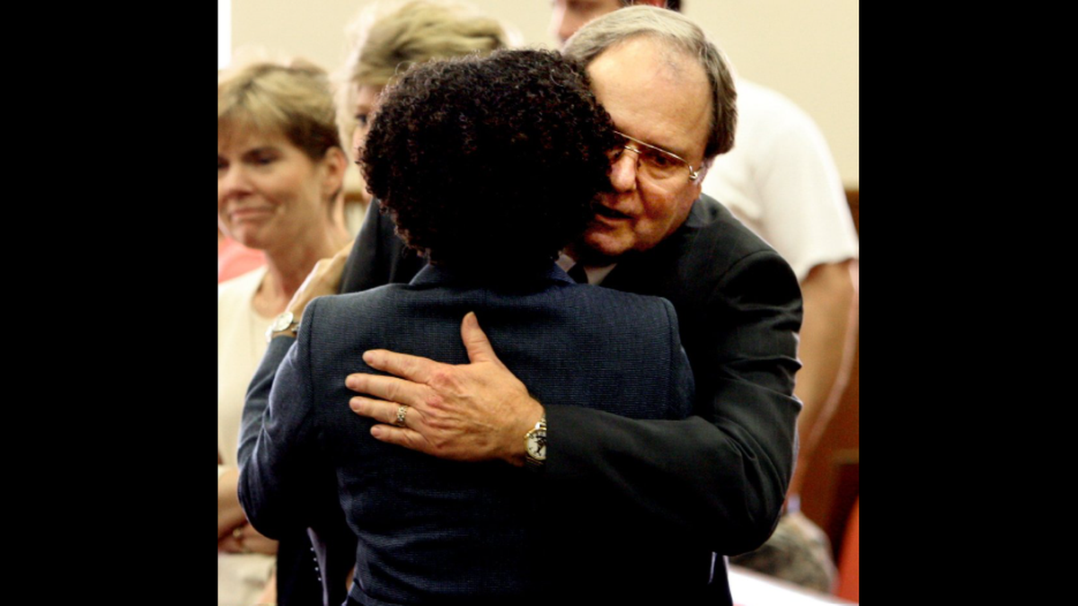 Felecia Dunn-Burks, attorney for Alexander Lett, hugs Jack Eddins after the sentencing for Alexander Lett. Eddins is the older brother of Donald Ray Eddins who Lett killed in February 2005.