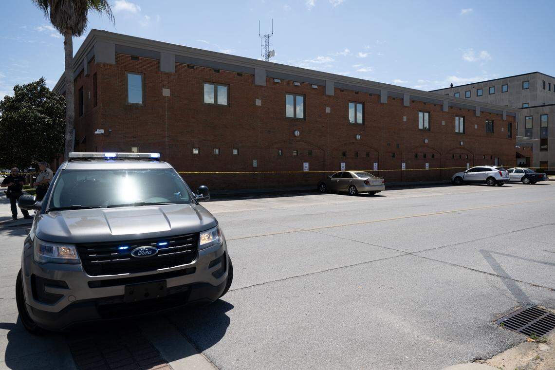 A police car is parked Thursday outside the Jackson County Courthouse in Pascagoula after a shooting.