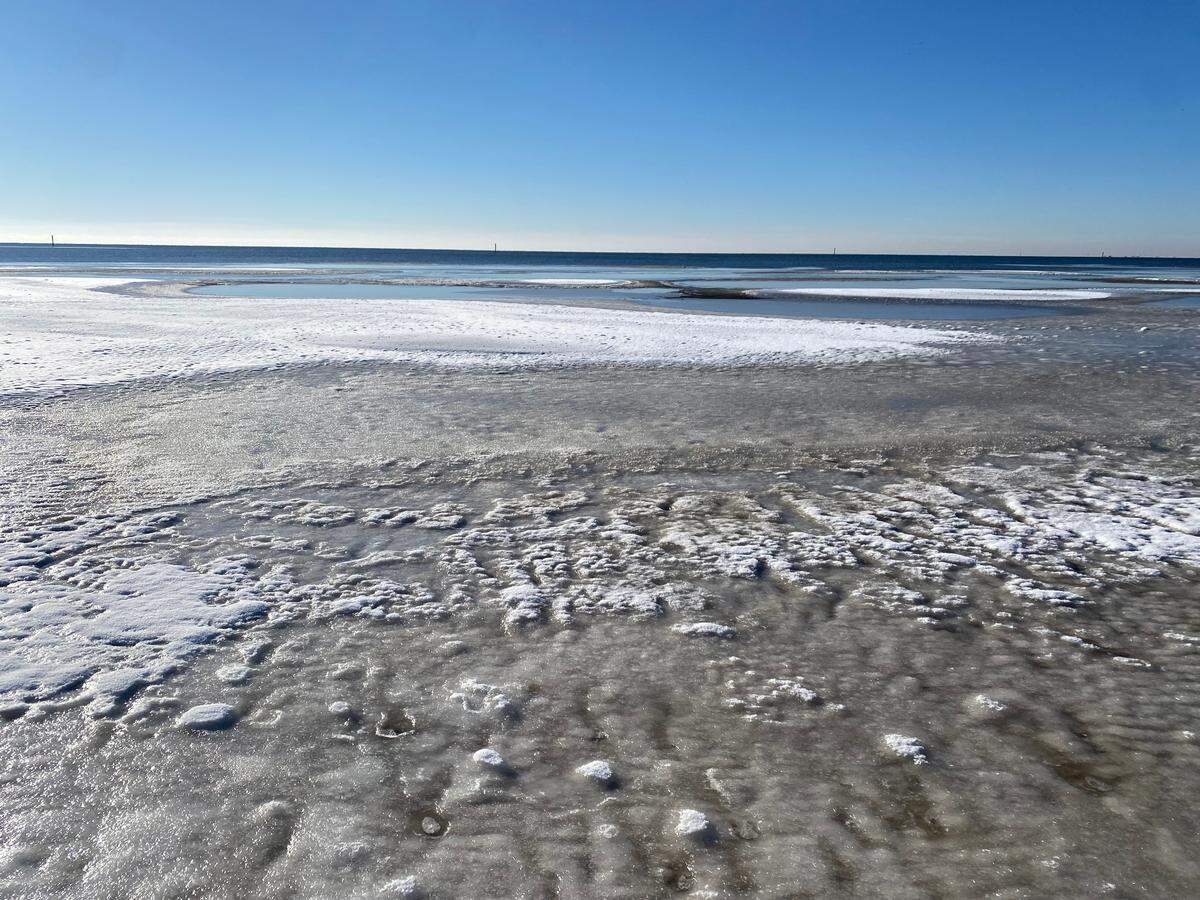 The shoreline froze the morning of Wednesday, Jan. 22, 2025 in Pass Christian, one day after a historic snow storm swept across the Mississippi Coast.