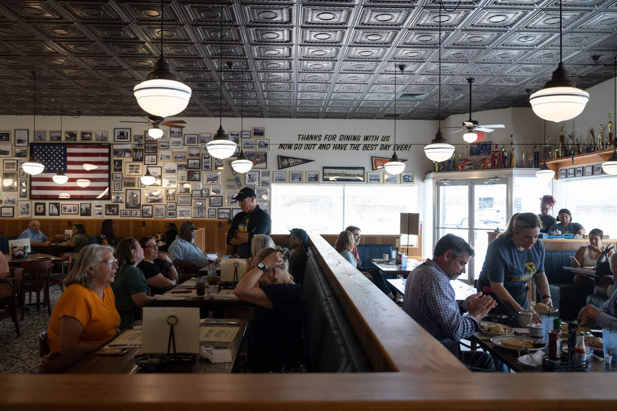 Customers are seated in booth seats during the opening day of The Downtowner in Gulfport on Tuesday, June 9, 2026.