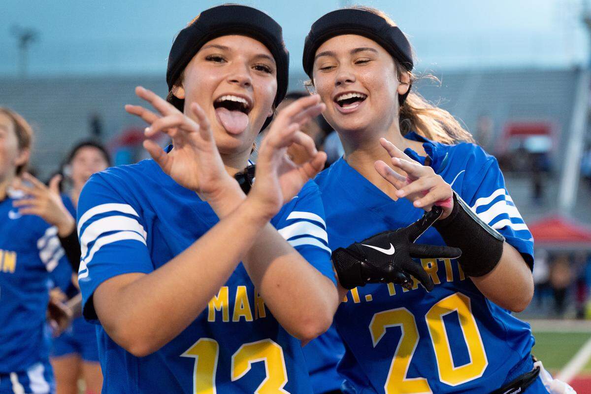St. Martin players celebrate after Molly Noblitt (13) gets an interception during a flag football playoff game at Pascagoula High School on Thursday, April 30, 2026.