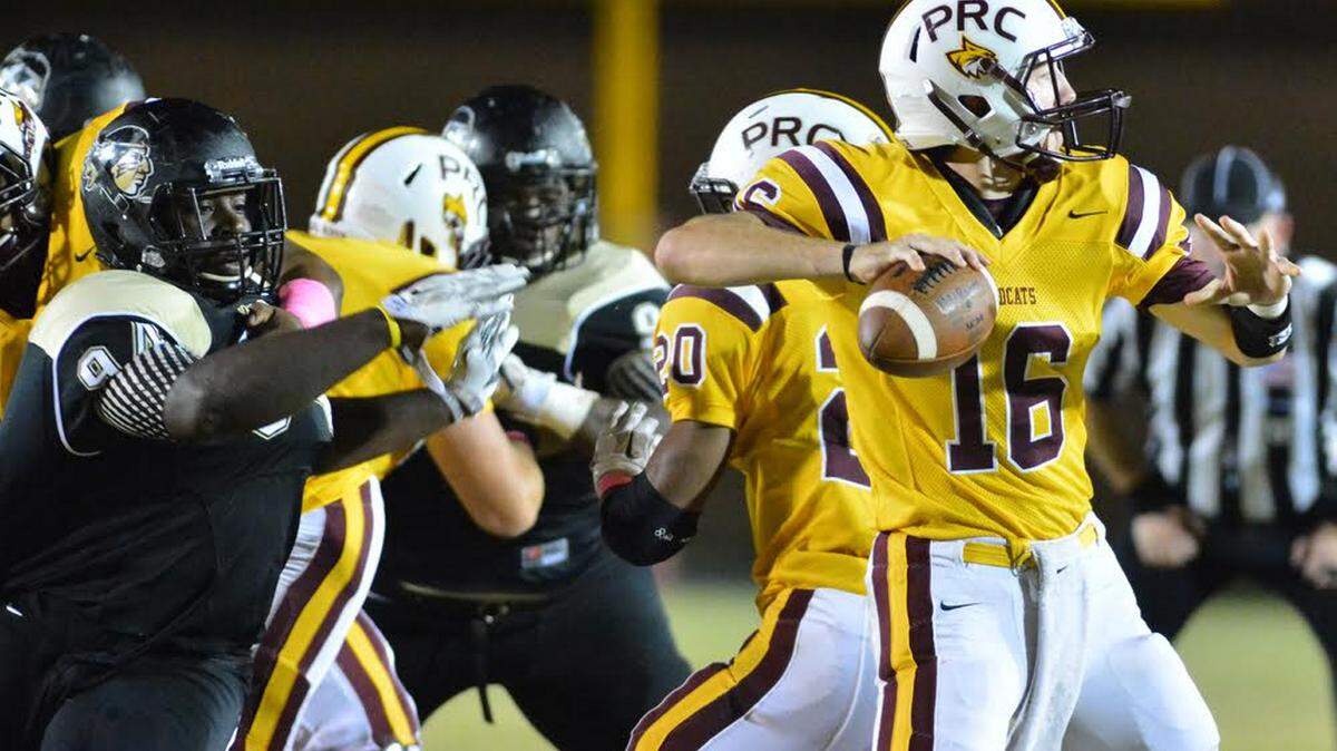 MATT BUSH/JUCO WEEKLY 
 An East Central defender draws a bead on Pearl River quarterback Marshall Kranz during junior college football action Thursday night at Poplarville.