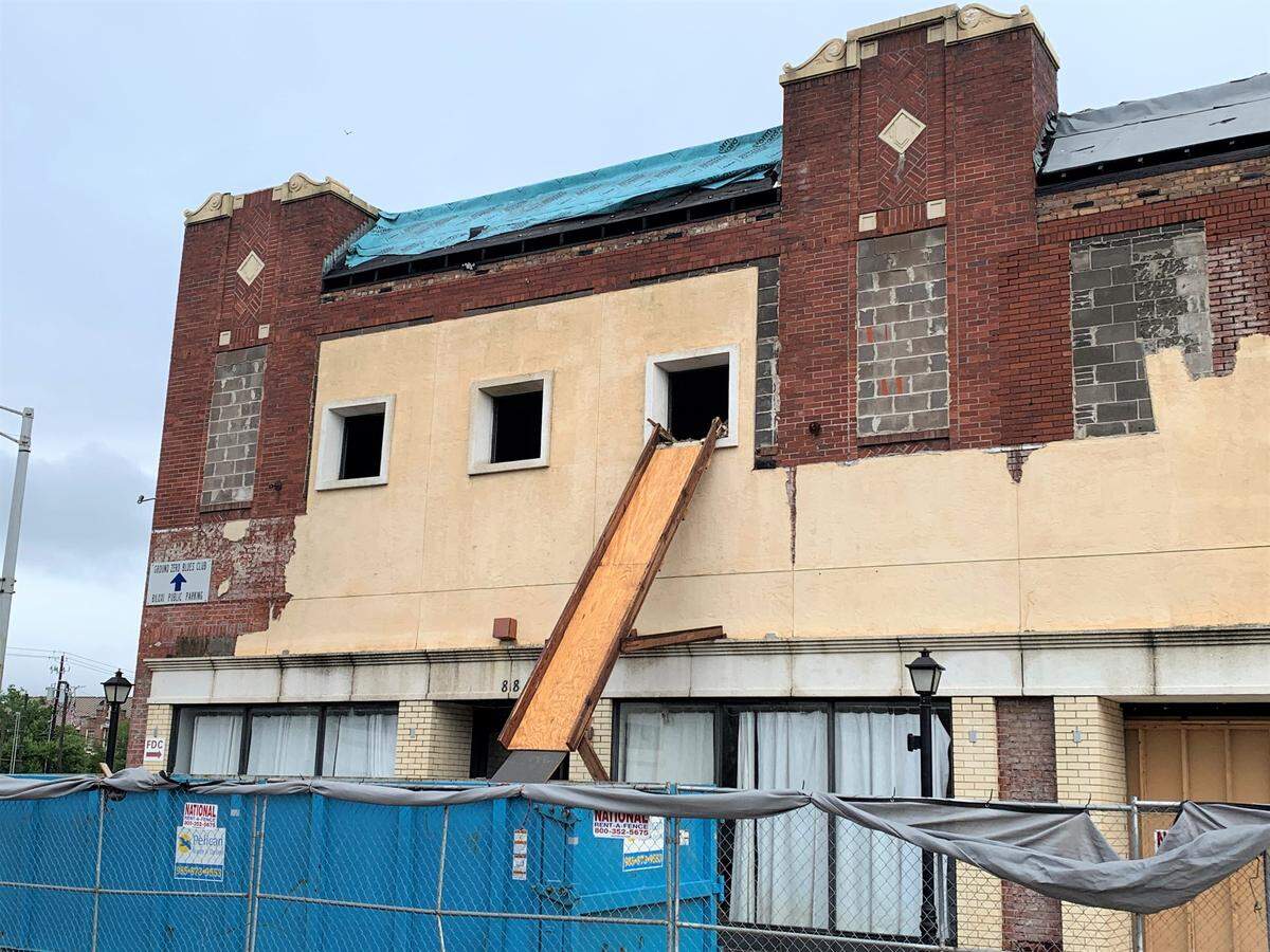 The original brick exterior of the Barq Building, hidden behind mustard-colored siding during Urban Renewal, was revealed during work to restore the building into The District on Howard. The mixed use development on Howard Avenue will provide downtown living atop businesses.