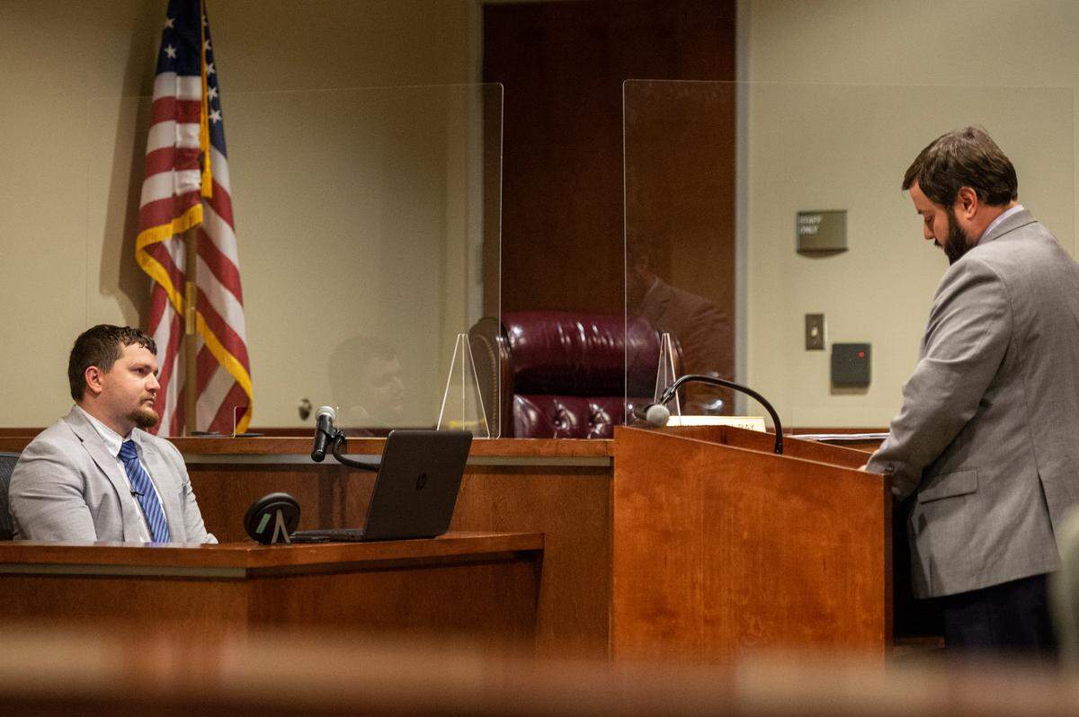 Damien Holcomb questions Gulfport Police Officer Klein on the witness stand during a preliminary hearing for a murder case at Harrison County Justice Court in Gulfport on Wednesday, Jan. 19, 2022.