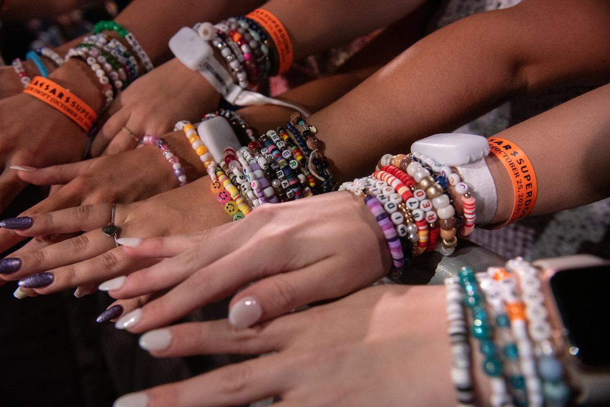Fans show off their friendship bracelets before Taylor Swift’s The Eras Tour at the Cesars Superdome in New Orleans on Friday, Oct. 25, 2024.