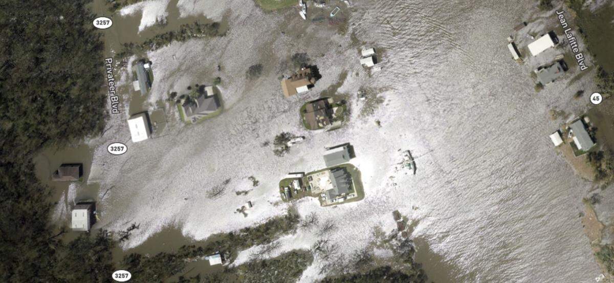 Water surrounds homes at Jean Lafitte, La., a day after Hurricane Ida landed on Aug. 29, 2021.