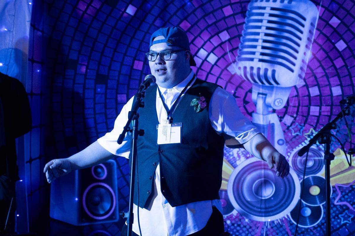 Jesse Sebring sings karaoke during Night to Shine at Woolmarket Baptist Church on Friday, Feb. 13, 2026.