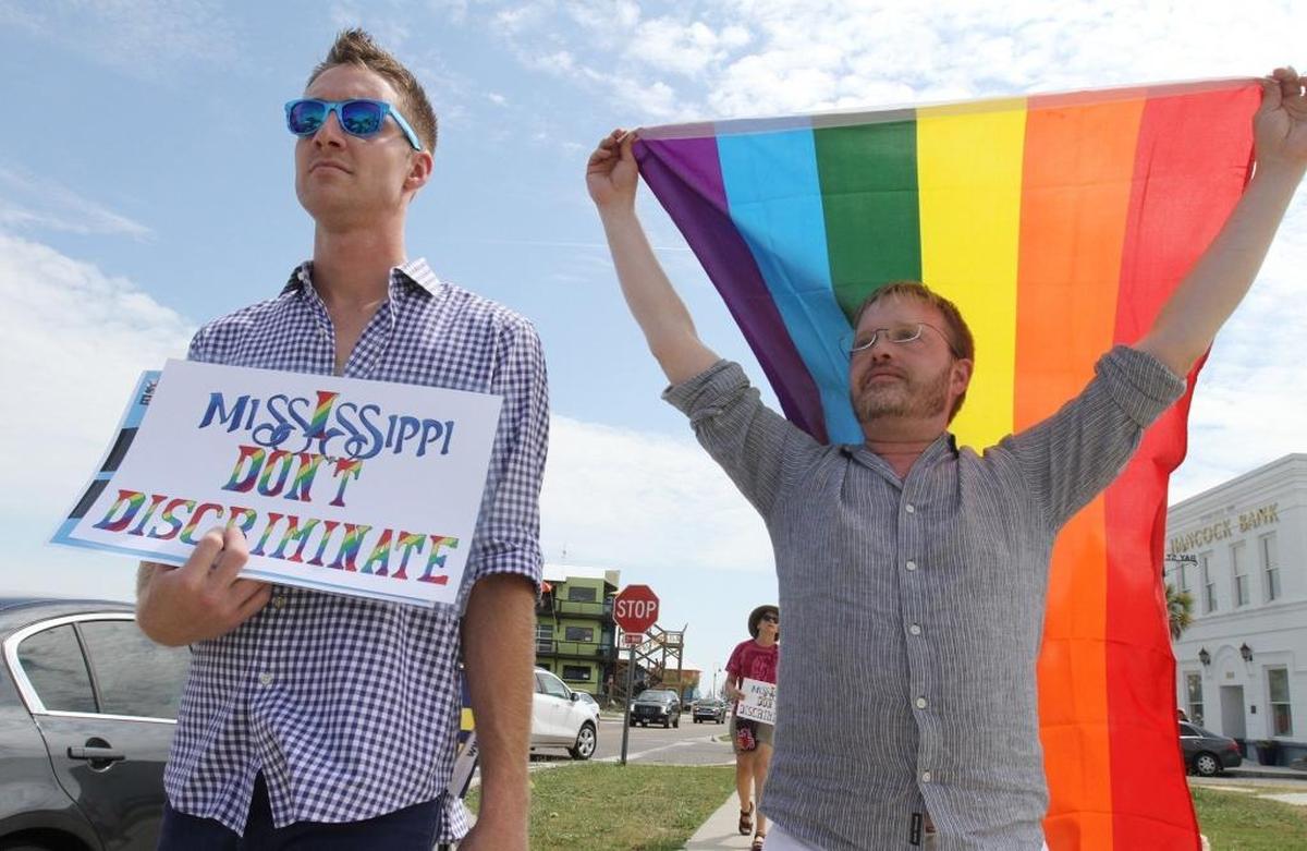 Aaron Polk, left, and Eric Wood, both of Jackson, march in a No Hate in Our State rally in Bay St. Louis in May. Bay St. Louis was named the second-best city for LGBTQ residents to live and work in the state by the Human Rights Campaign.