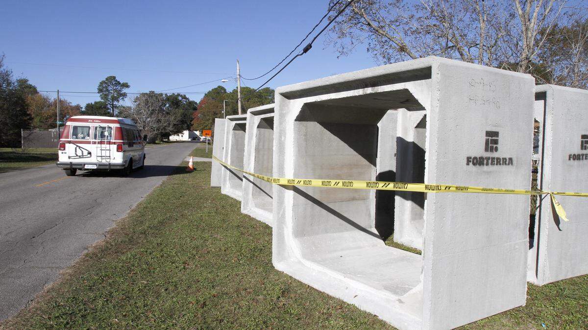 TIM ISBELL/SUN HERALD 
 Box culverts on Texas Avenue in Gulfport, pictured on Friday, Dec. 4, 2015, are being installed under the road to replace smaller pipe. The culverts will improve drainage from stormwater runoff.