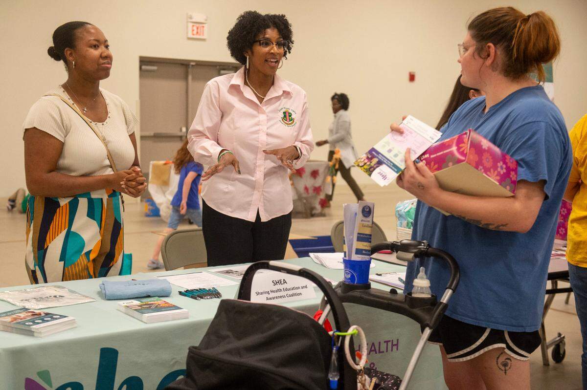 Expecting families meet with vendors during a community baby shower event at Lyman Community Center in Gulfport on Thursday, Nov. 14, 2024.