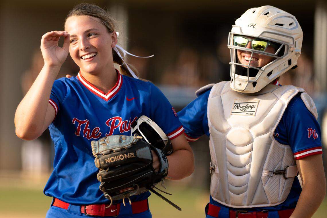 Pass Christian players celebrate Bristol Jones (15) getting her 500th strikeout Friday against Lawrence County.