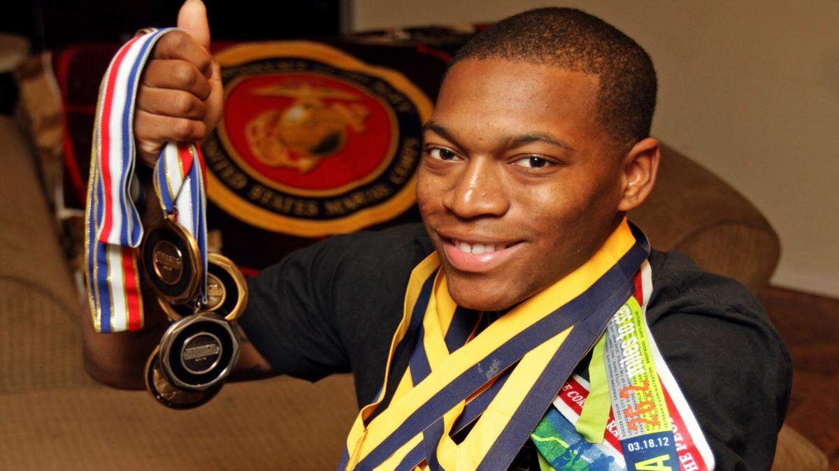 JOHN FITZHUGH/SUN HERALD 
 Sgt. Anthony McDaniel Jr. shows off the medals he has won in sporting competitions since he lost his limbs to an improvised explosive device in Afghanistan. The 2006 Gautier High graduate is representing Team USA in the Invictus Games.
