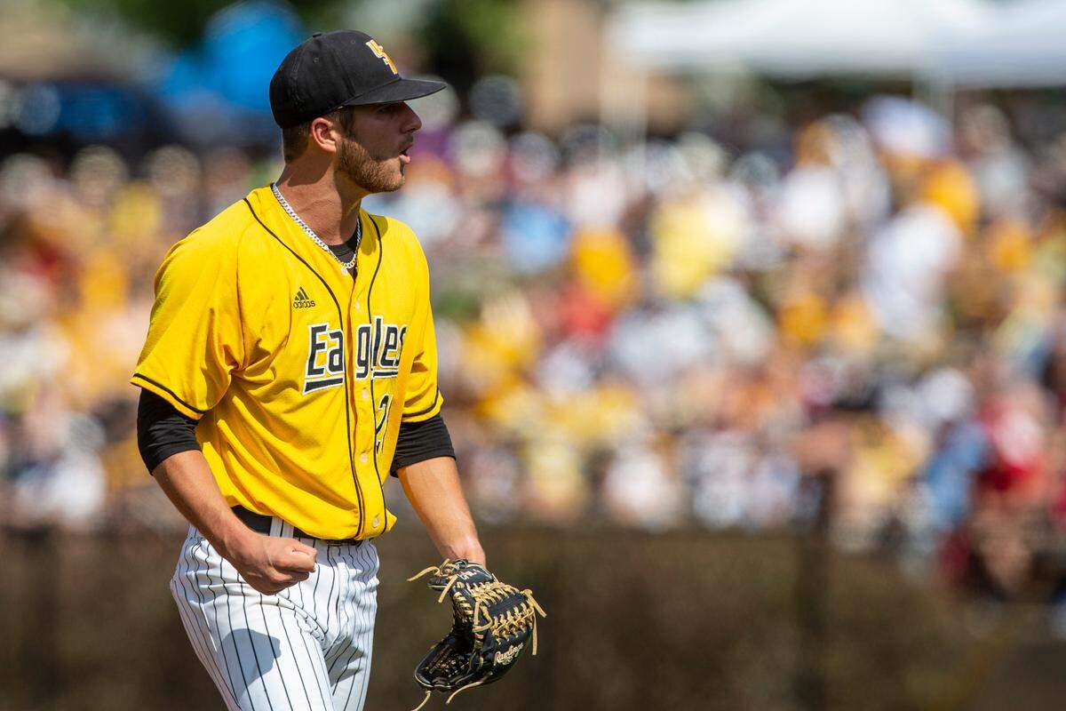 Southern Miss starting pitcher Tanner Hall cheers after an inning during the Super Regionals Final at Pete Taylor Park in Hattiesburg on Sunday, June 12, 2022.