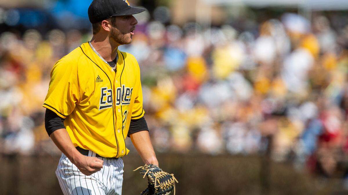 Southern Miss starting pitcher Tanner Hall cheers after an inning during the Super Regionals Final at Pete Taylor Park in Hattiesburg on Sunday, June 12, 2022.
