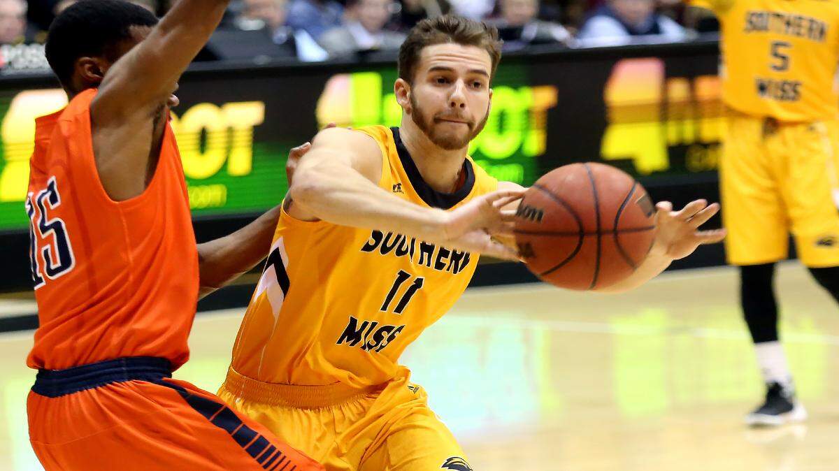 AMANDA McCOY/SUN HERALDSouthern Miss guard Michael Ramey passes the ball while defended by UTEP guard Tevin Caldwell on Thursday, January 28, 2016, in Hattiesburg. 