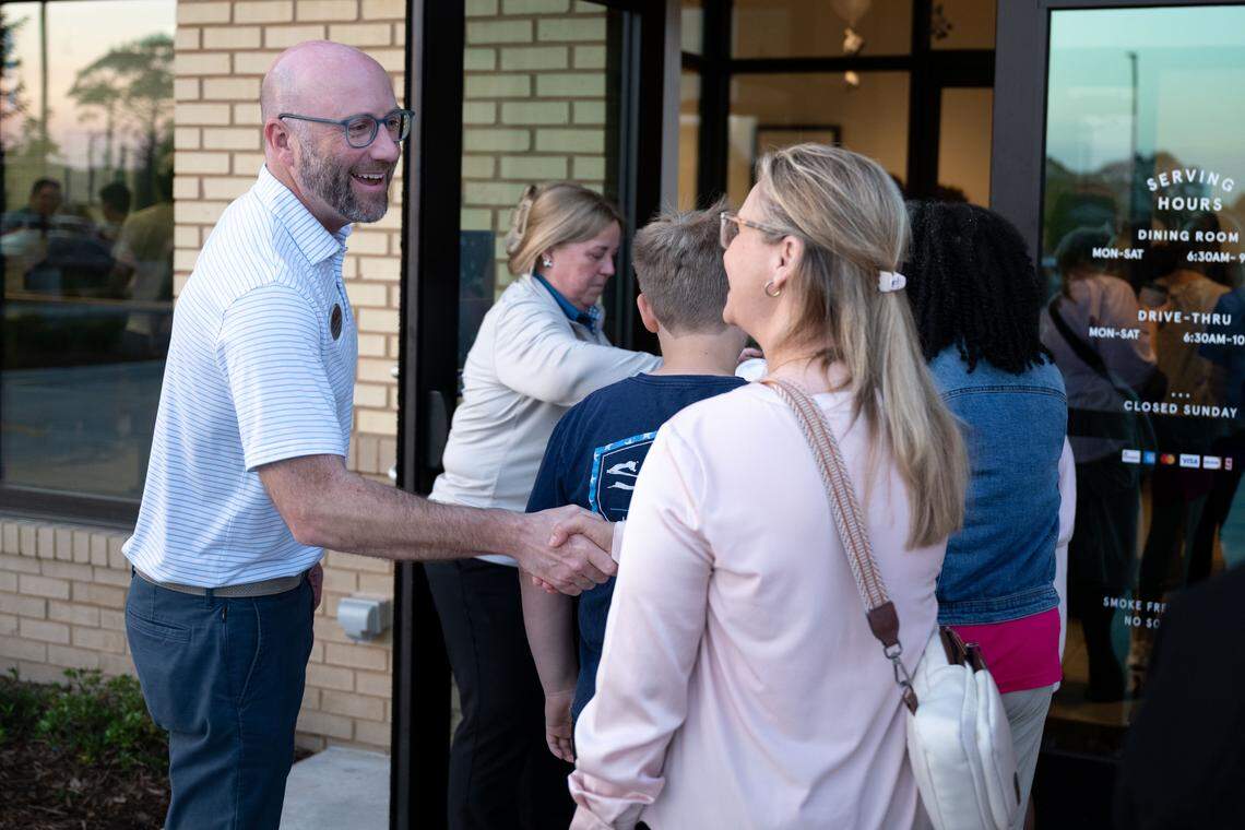 Owner-operator Craig Smith welcomes some of the first customers through the doors.