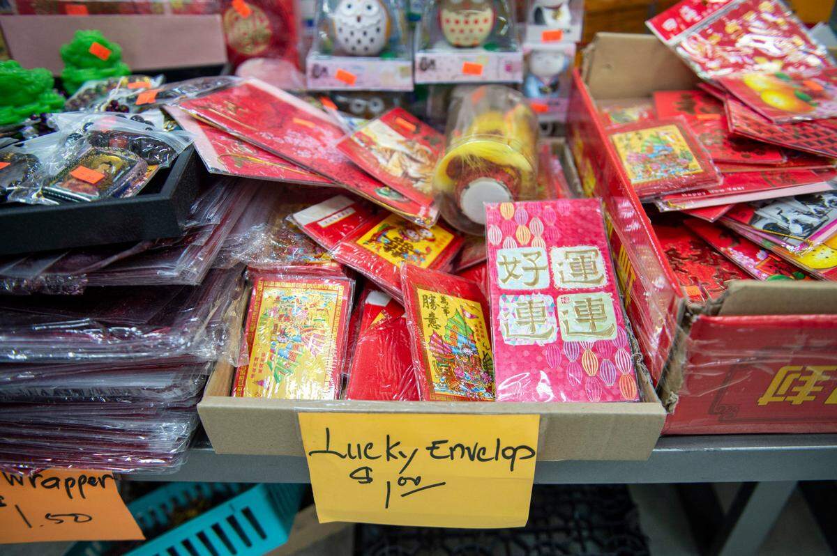 Lucky red envelopes, used to pass out money for the Lunar New Year, on sale at Lee’s Grocery, an Asian supermarket in Biloxi, on Monday, Jan. 24, 2022.