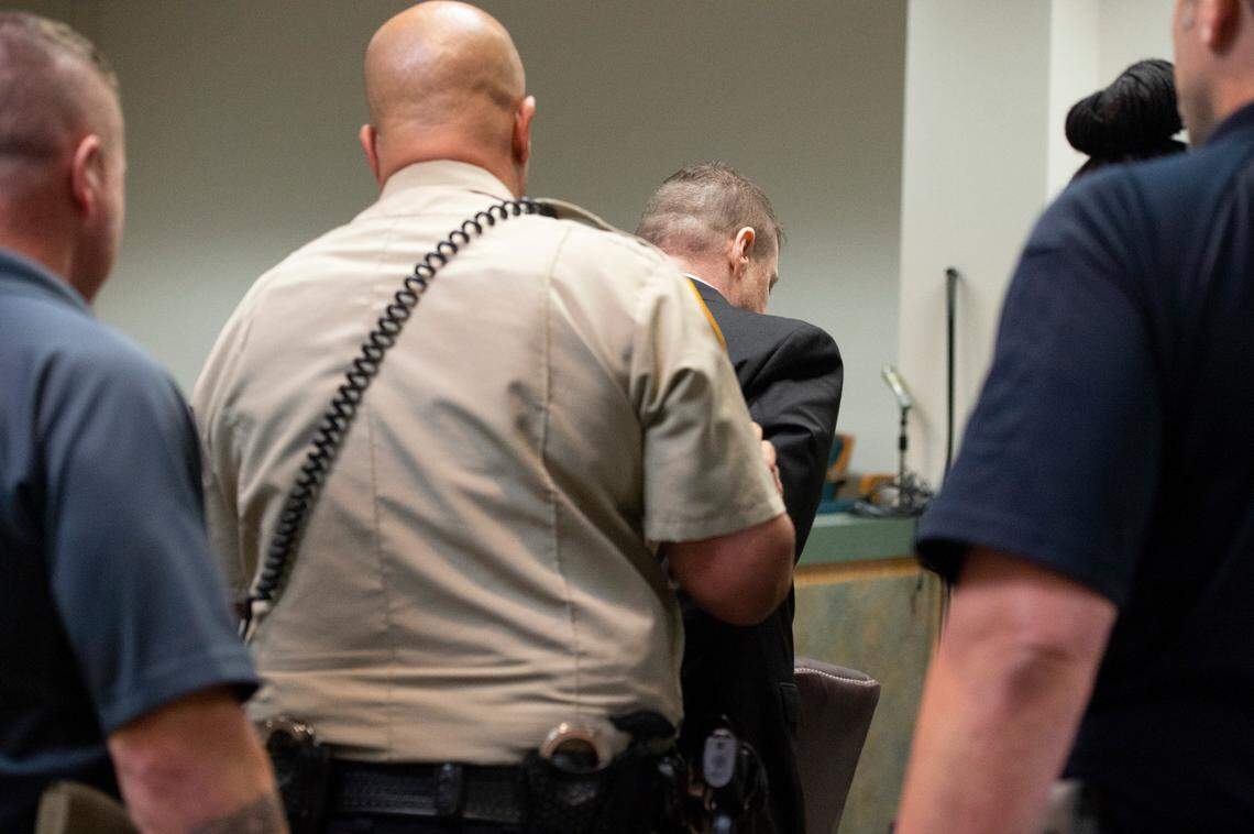 Police handcuff Jacob Blair Scott after he is determined to be guilty on all charges during his trial for sexual abuse charges at Jackson County Circuit Court in Pascagoula on Thursday, June 2, 2022.