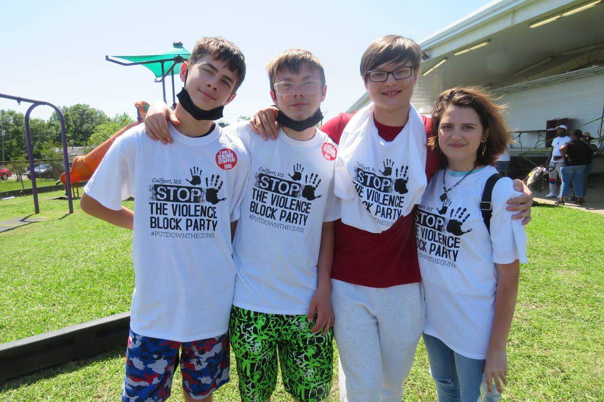 Johnathan Balser, second from left, and Douglas Jackson, second from right, attended the Stop the Violence Block Party in Gulfport with friends on Saturday, May 15, 2021.