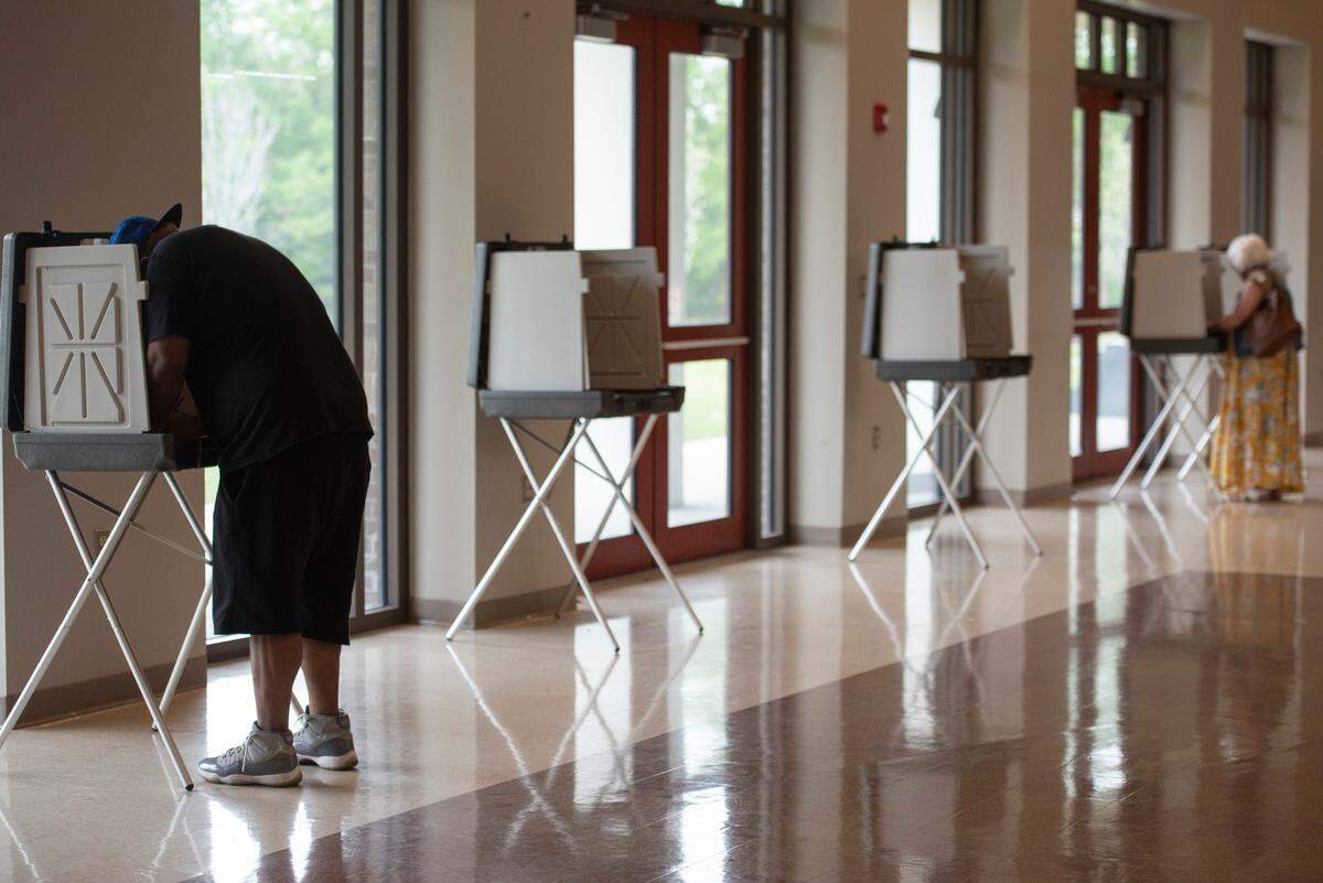 Voters fill out ballots at a polling place at Orange Grove Community Center during a municipal primary election in Gulfport on Tuesday, April 1, 2025.