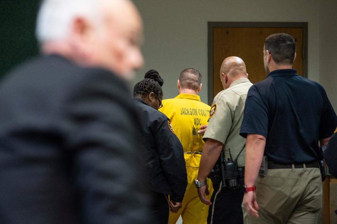 Jacob Blair Scott is escorted out of the courtroom by police after being given his sentence during a sentencing hearing for his abuse of a minor in Jackson County Circuit Court in Pascagoula on Thursday, June 2, 2022. Scott was sentenced to 85 years in prison.