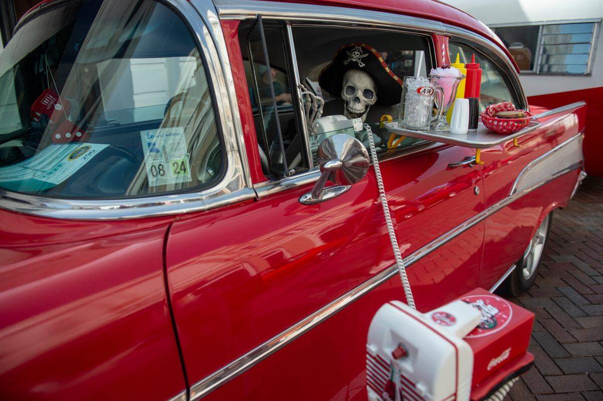 A plastic pirate skeleton sits is in the driver’s seat of a classic car at the Biloxi Block Party, one of many Cruisin’ the Coast events. Follow traffic tips to avoid the busiest areas and times.