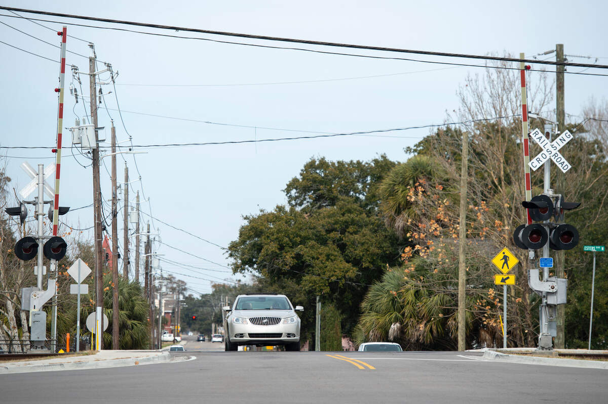 A car crosses over the Main Street railroad crossing in Biloxi on Tuesday, Jan. 28, 2025.
