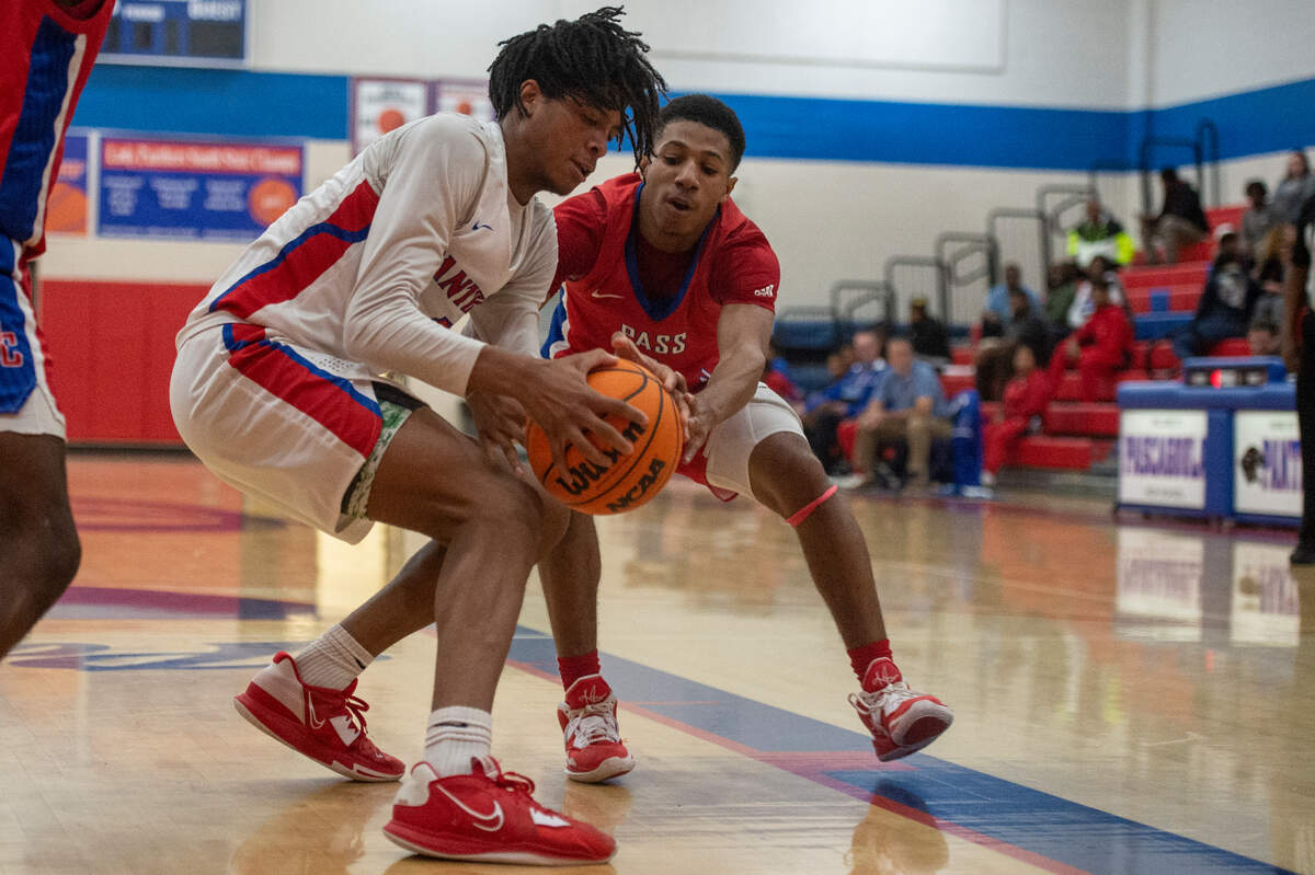 Pascagoula’s Pete Millender tries to protect the ball during a game against Pass Christian at Pascagoula High School on Tuesday, Dec. 20, 2022.