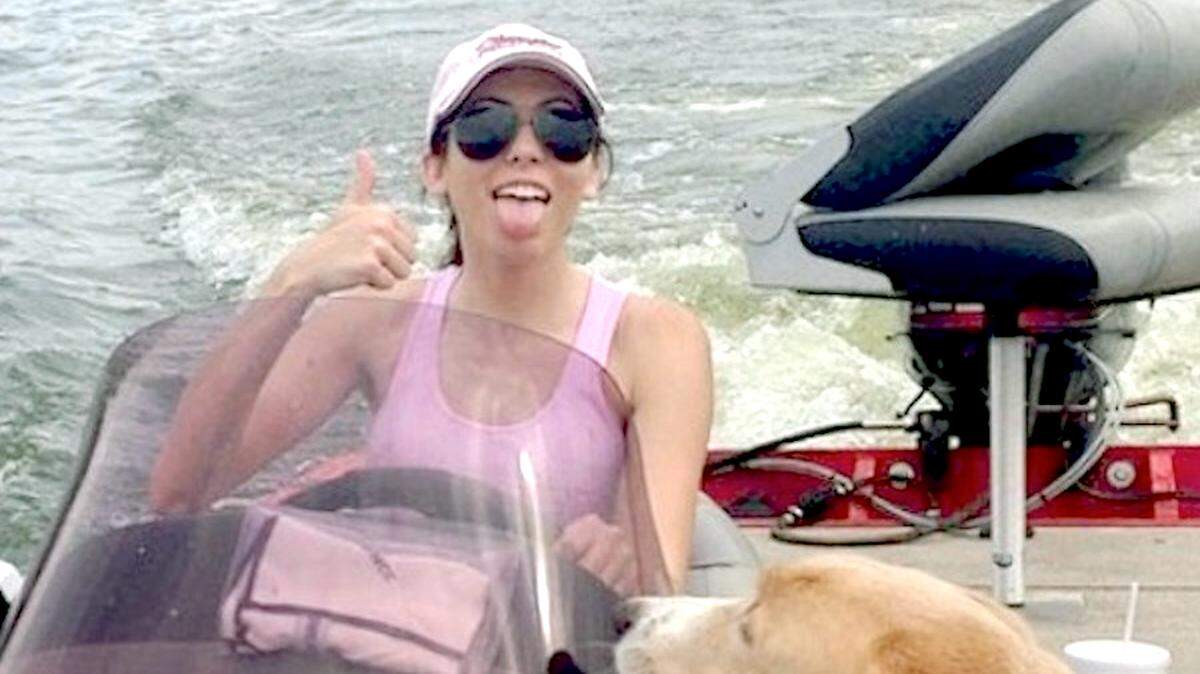 Katherine Sinclair with her dog Duke in her boat on Lake Eddins. She was shot to death June 1, 2017, at her boyfriend’s home in Laurel.