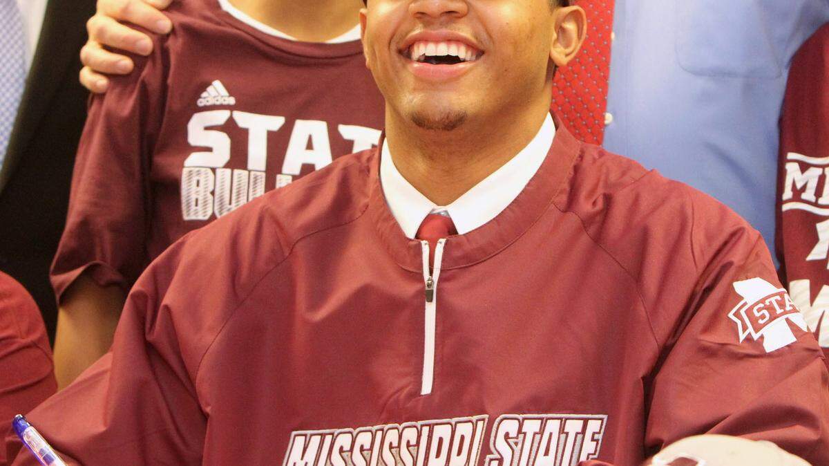 JOHN FITZHUGH/SUN HERALDPascagoula High School's Keith Joseph Jr. poses for National Signing Day photos on Wednesday Feb. 4, 2015. Joseph was killed in a car accident in Greene County on Friday.
